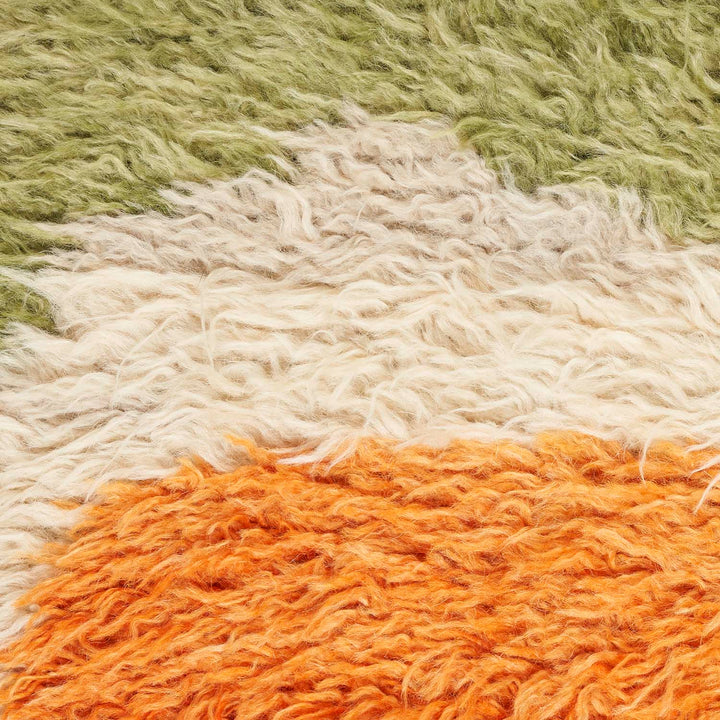 Gradient of colors on textured fabric creates a cozy ambiance.