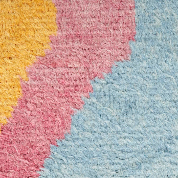 Vibrantly colored textured surface creates a visually striking abstract composition.