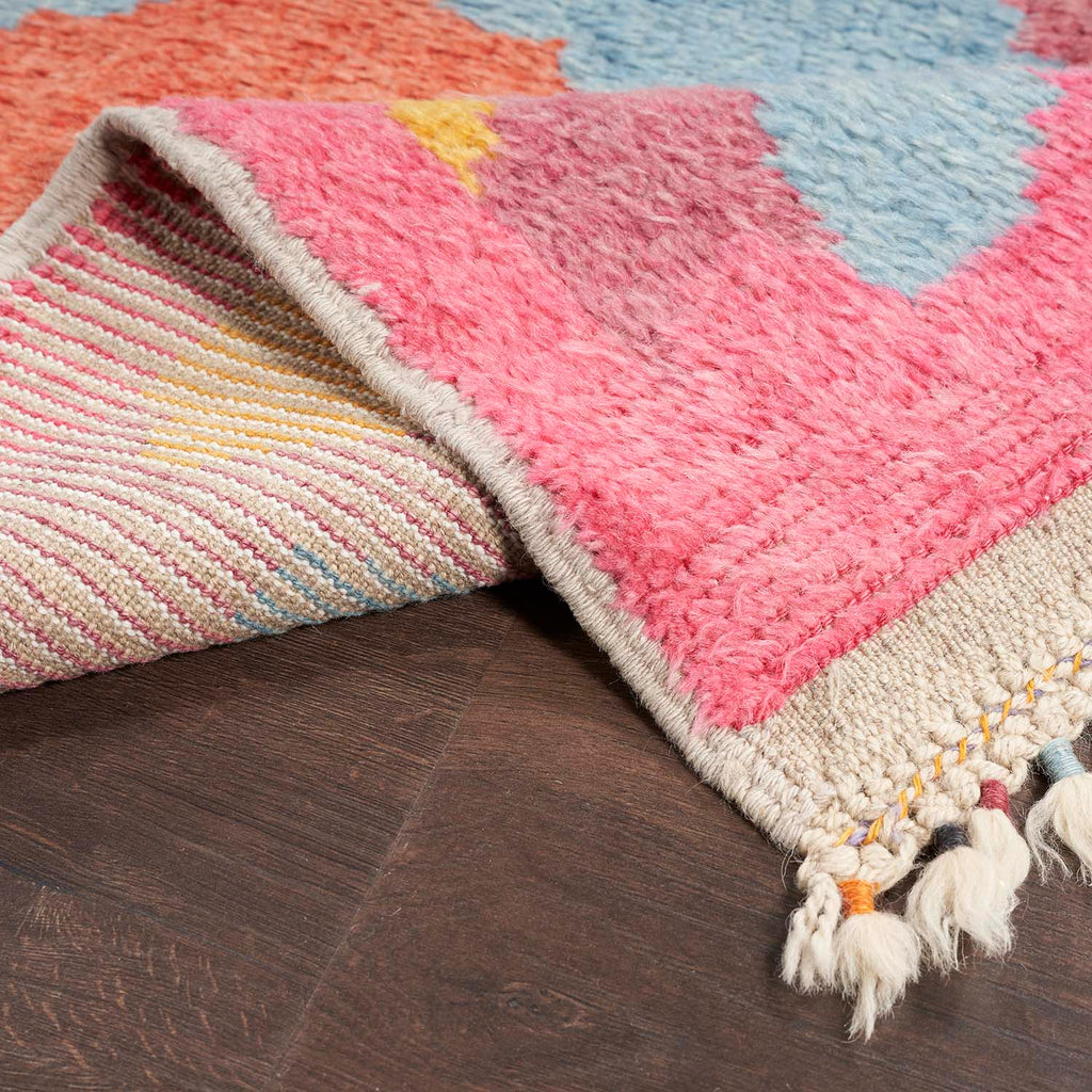Colorful area rug with plush texture and vibrant patterns.