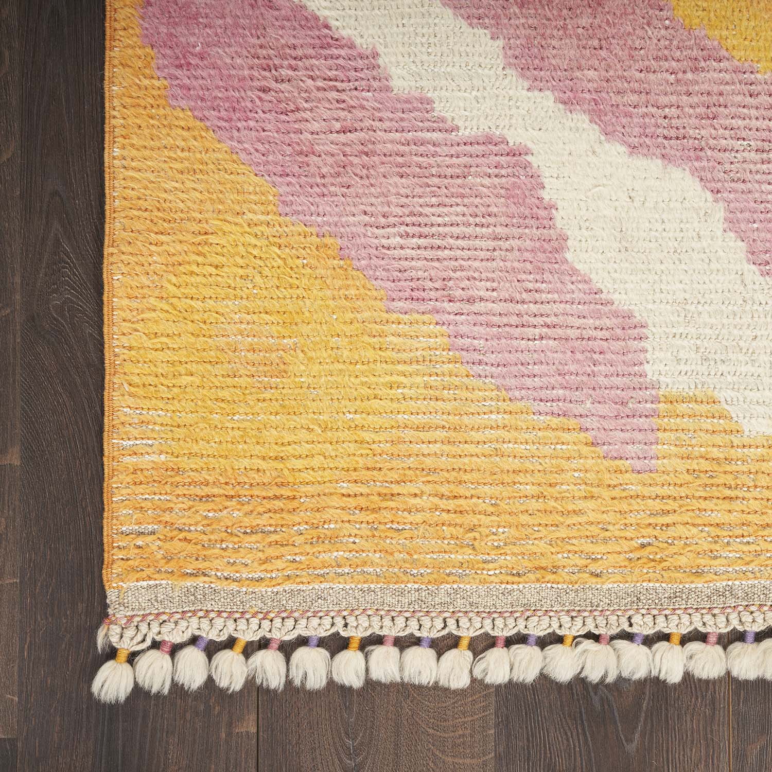 Vibrant geometric rug with diagonal stripes adds movement to space.