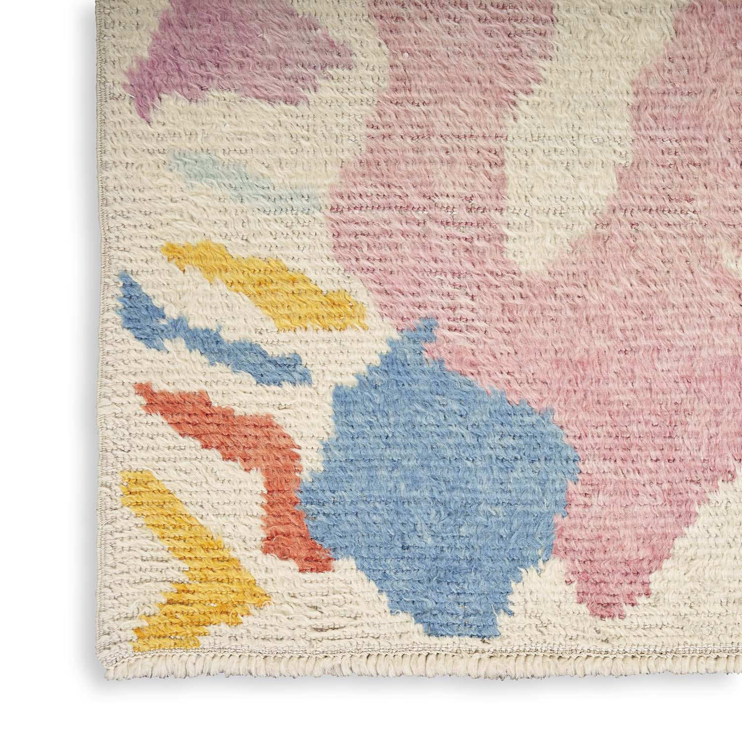 Abstract looped pile rug with pastel colors and textured look.