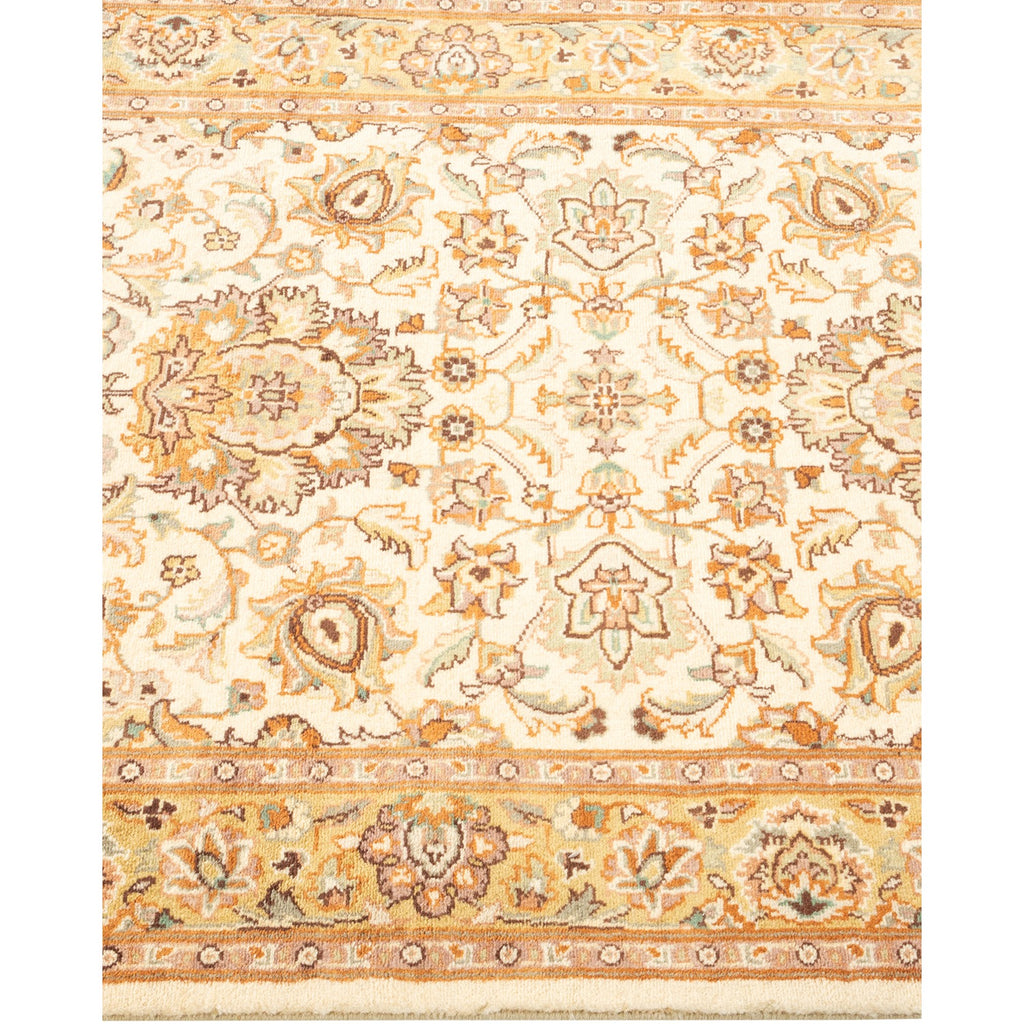 Intricate, symmetrical floral motifs adorn a traditional Persian-inspired carpet.