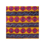 Colorful, intricate patterned fabric evoking rich ethnic folk traditions.