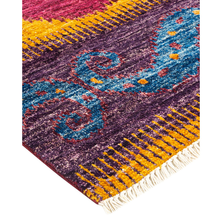 Vibrantly colored rug with intricate patterns and traditional weaving techniques.