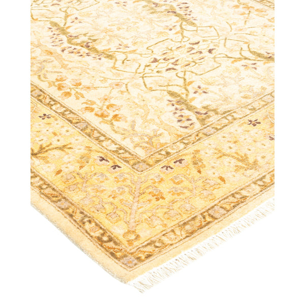 Intricate floral motif and warm color palette adorn this ornate rug.