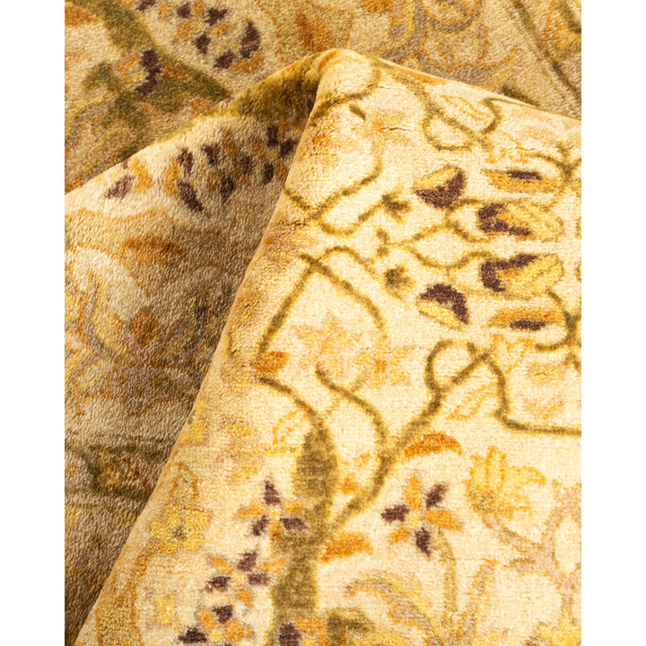 Close-up of a folded oriental rug with plush floral design.