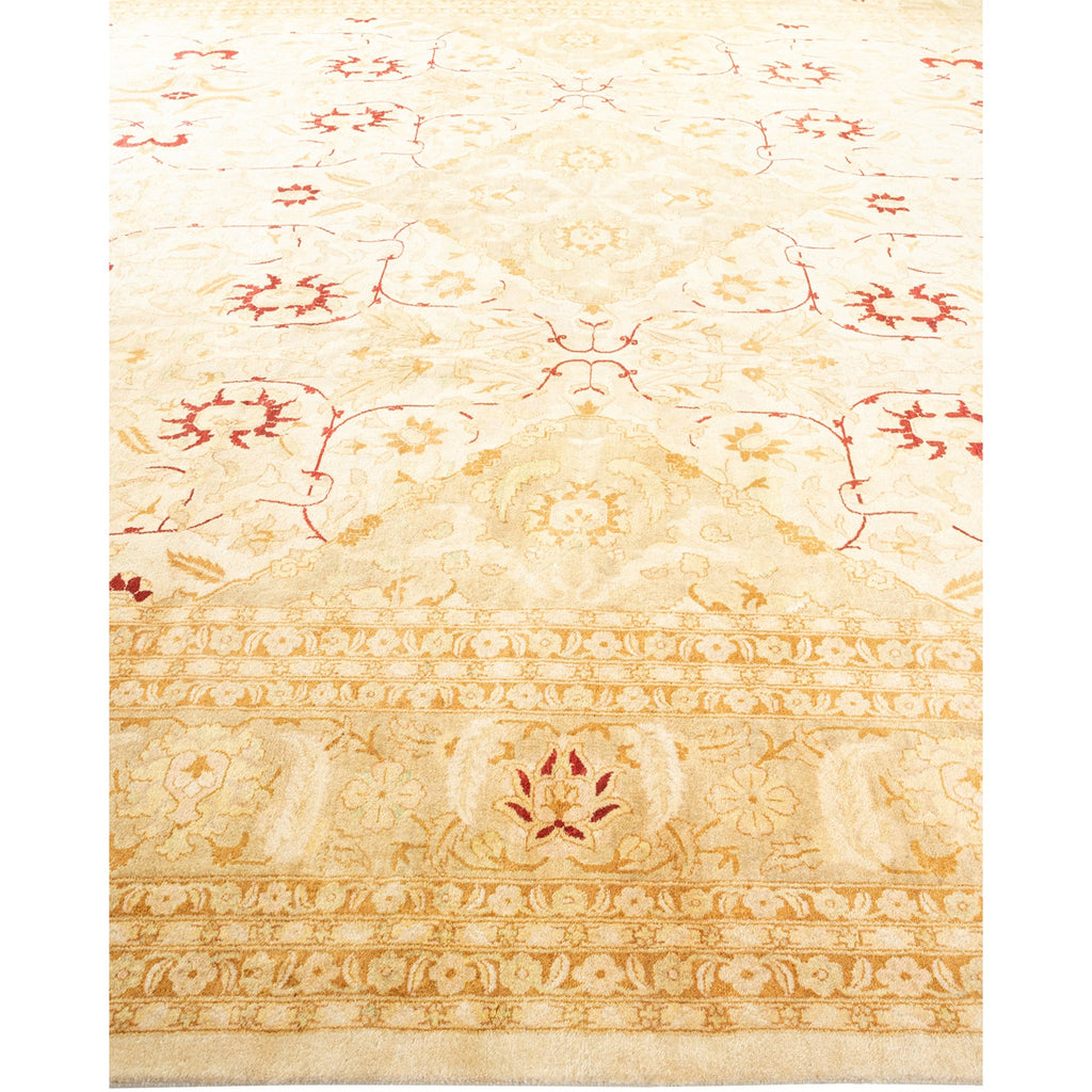 Intricately patterned beige and cream carpet with elegant floral motifs.