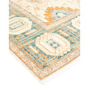 Intricately patterned rug corner with geometric shapes and warm tones.