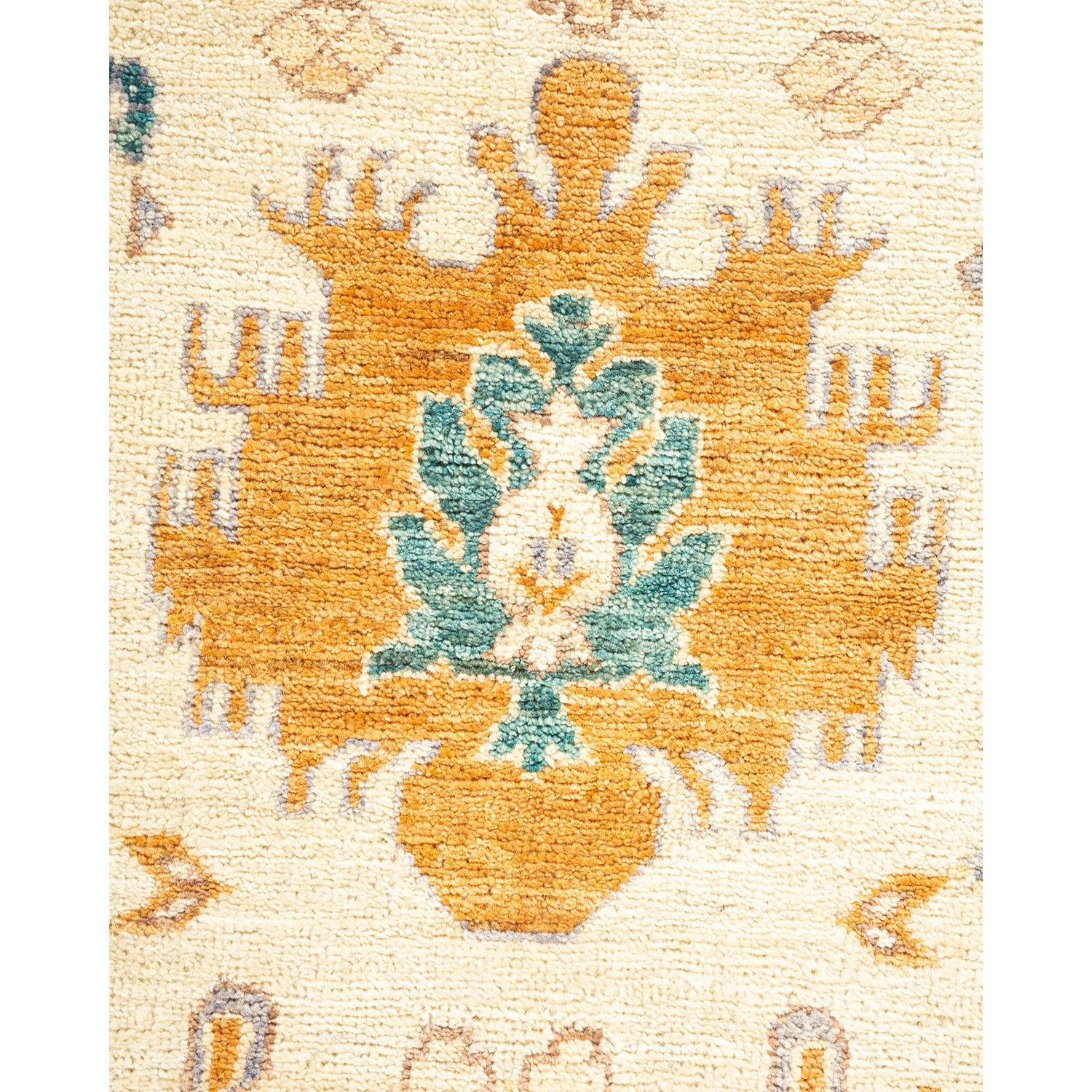 Close-up of a symmetrical floral pattern on a cream rug.