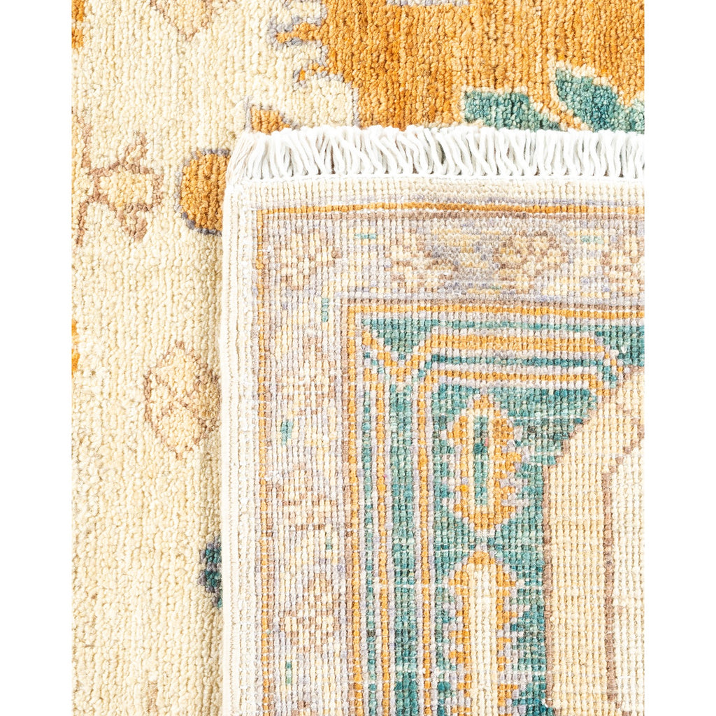 Close-up of an ornate rug showcases intricate design and texture.