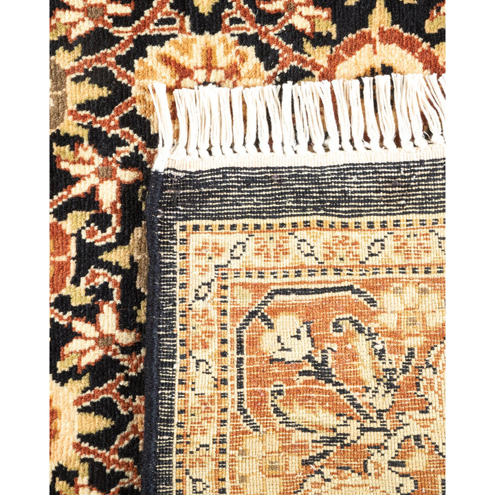 Intricate handwoven rug showcasing elaborate floral motifs and vibrant colors.