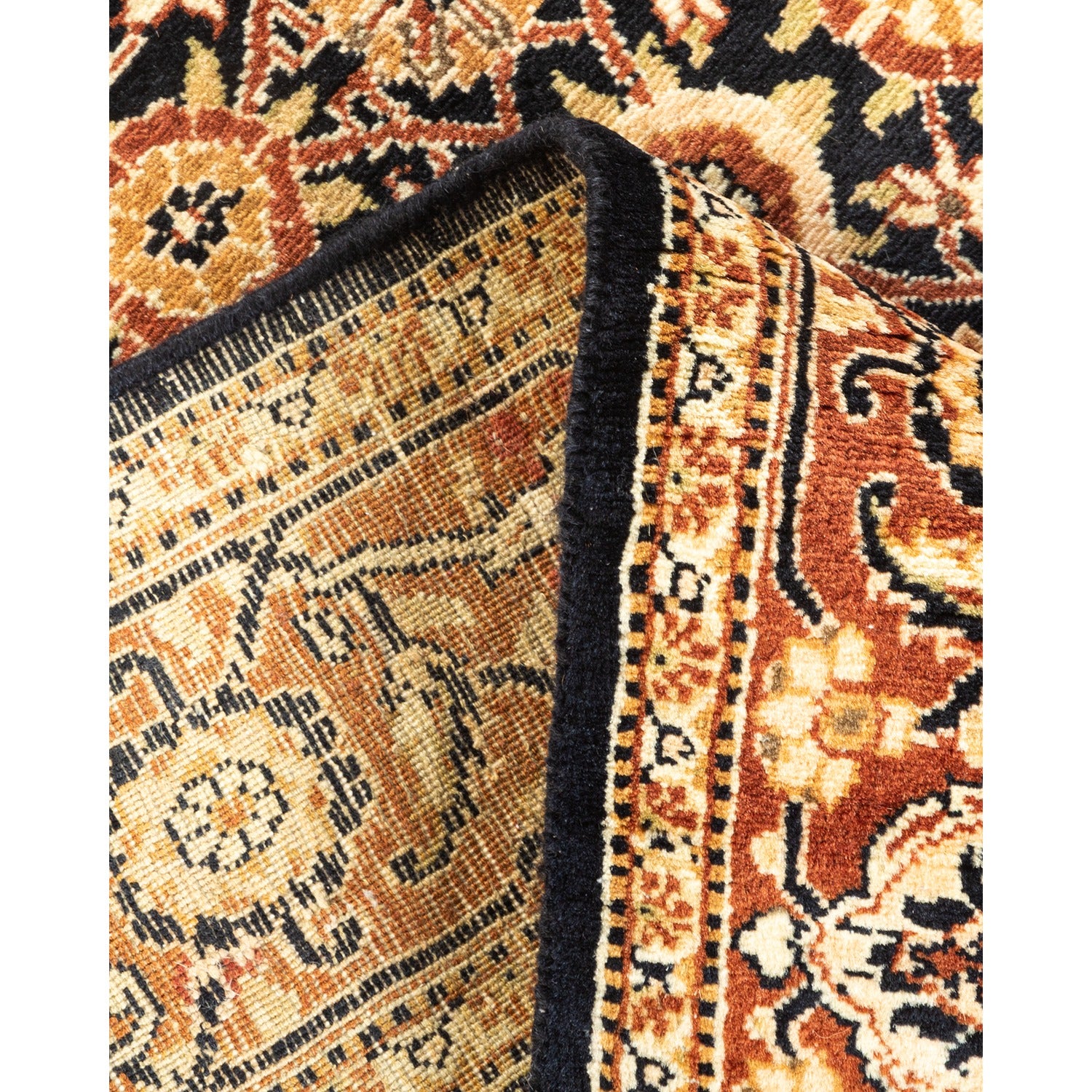 Folded oriental rug showcasing intricate patterns and expert craftsmanship.