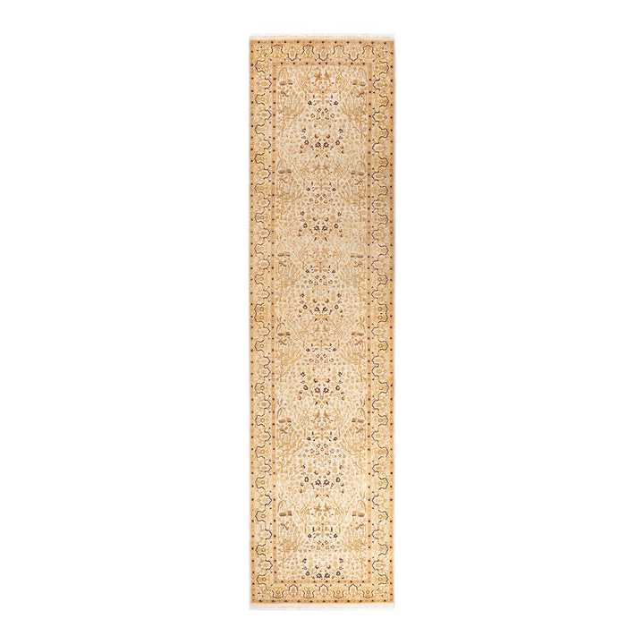 Exquisite beige rug adorned with intricate floral and geometric motifs.