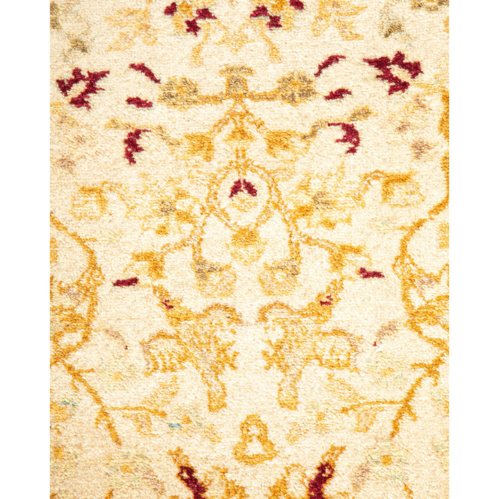 Close-up of a plush, patterned rug with ornate details.