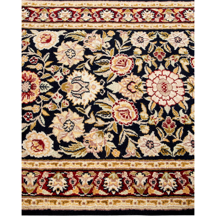 Exquisite hand-knotted rug displays vibrant floral motifs for luxurious ambiance.