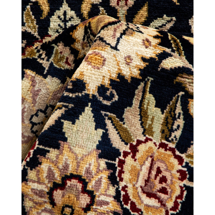 Close-up of a richly patterned oriental rug showcasing intricate floral motifs and traditional designs.