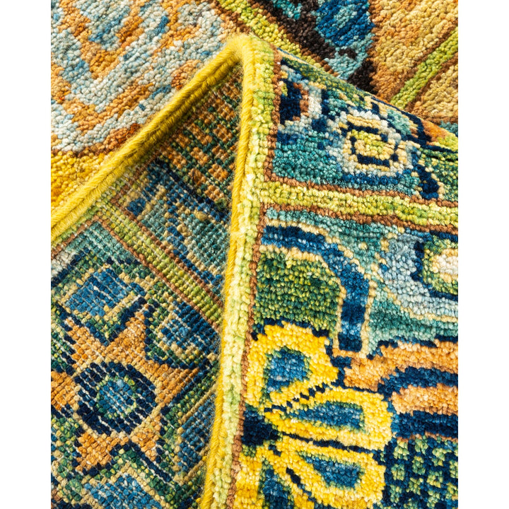 Colorful, intricately woven rug showcasing geometric and floral patterns.