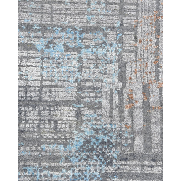 Abstract modern rug with neutral tones and geometric patterns.