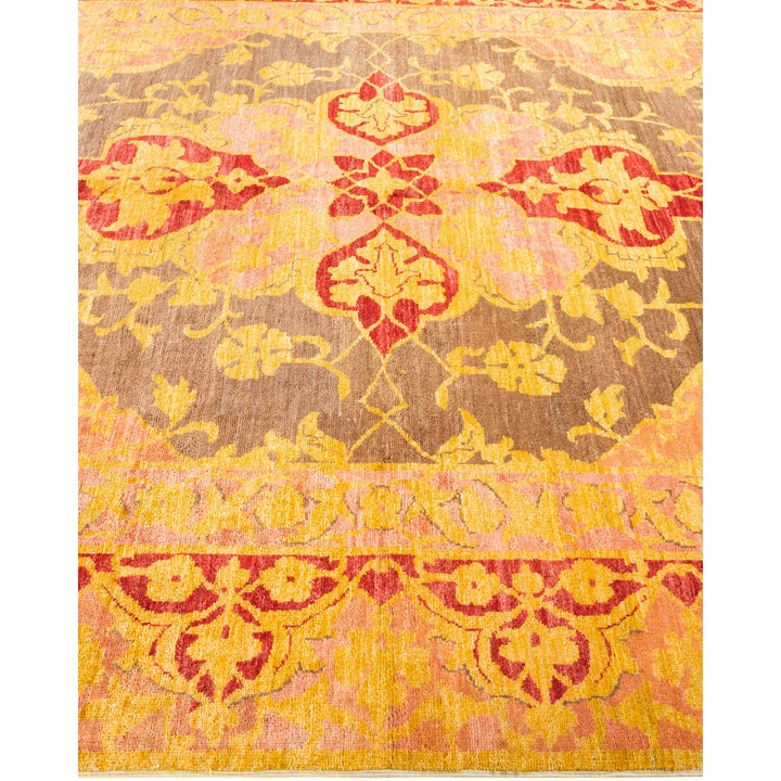 Ornate floral rug in shades of yellow and red.