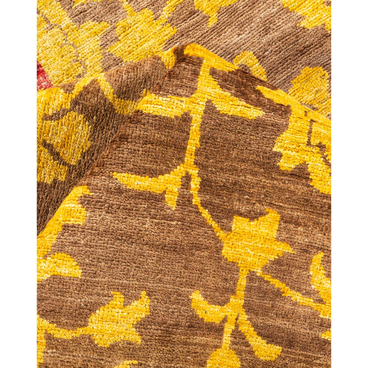 Intricate woven fabric featuring floral pattern in shades of brown and yellow