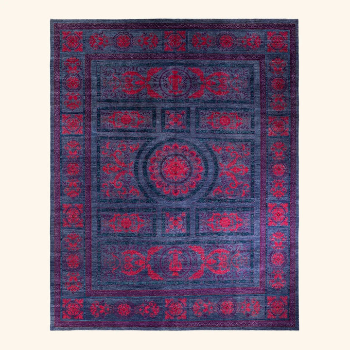 Ornate rectangular area rug with deep purple and vibrant red colors.