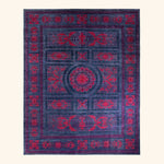 Ornate rectangular area rug with deep purple and vibrant red colors.