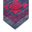 Vibrantly patterned rug showcases intricate floral design and cultural origins.