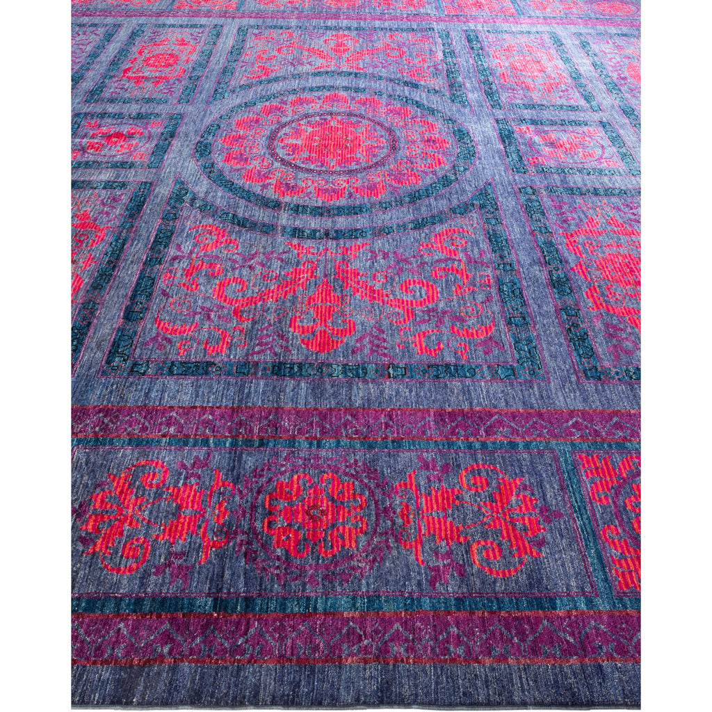 Decorative rug with intricate design in bold red and blue.