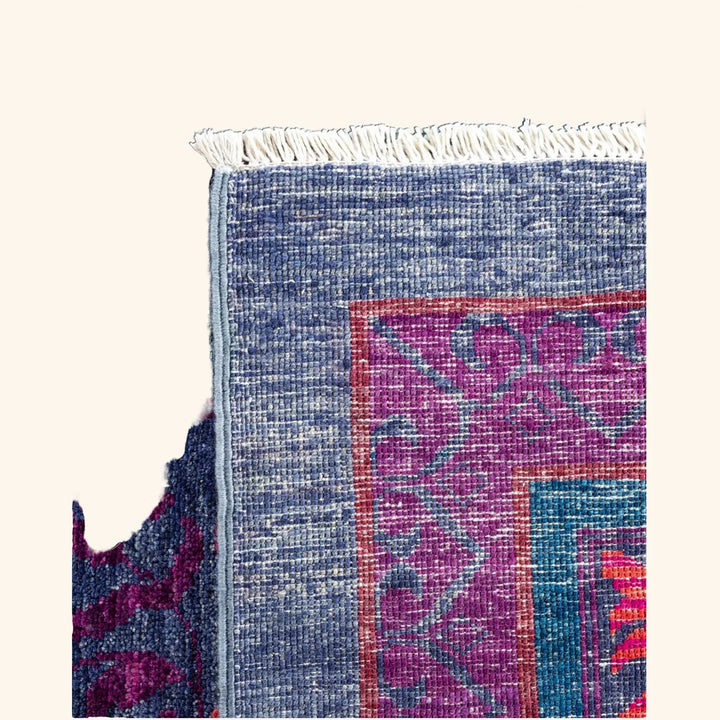 Close-up of a colorful, intricately woven textile showcasing masterful craftsmanship.