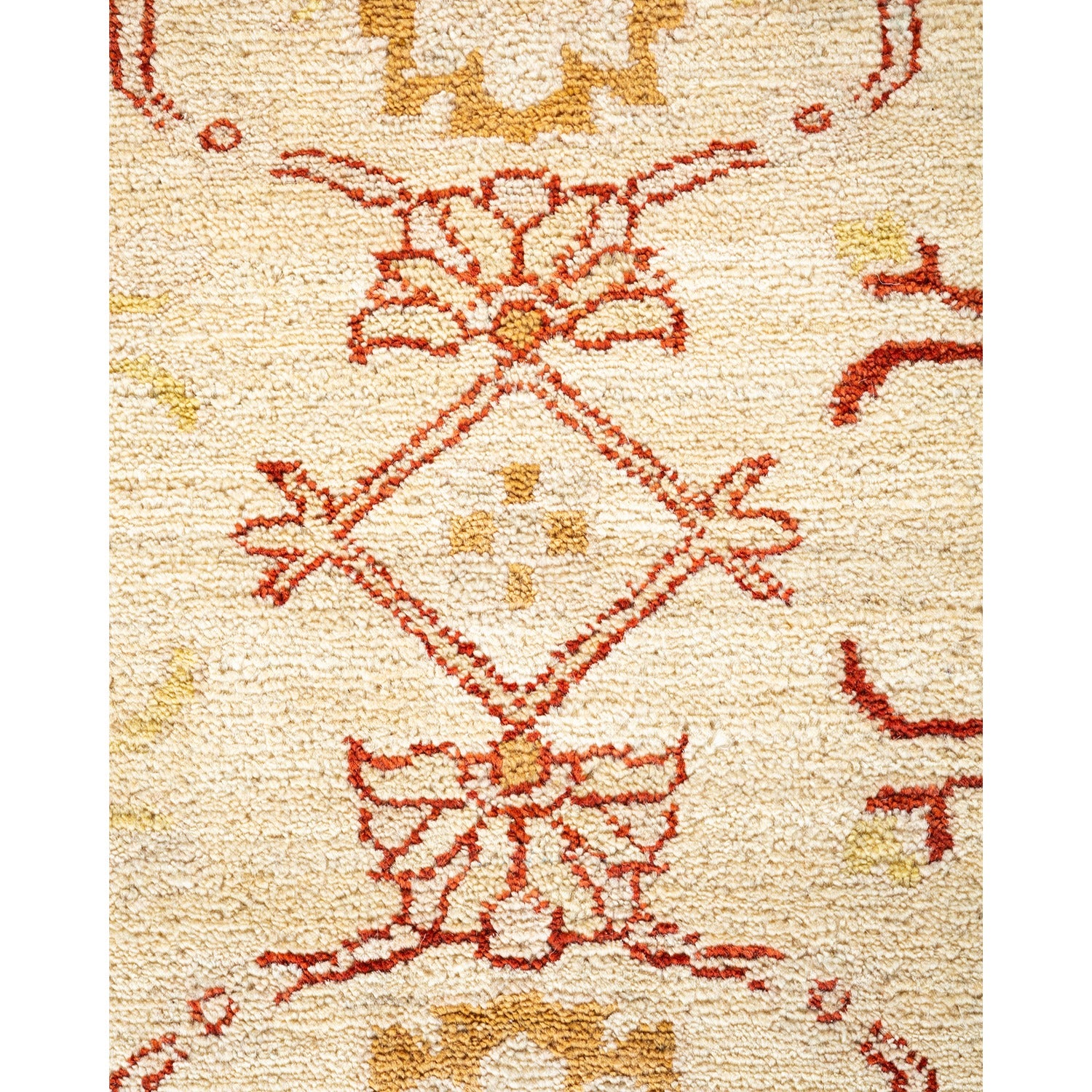Close-up of a symmetrical, intricate patterned rug in red hues.