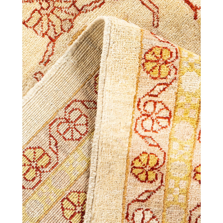 Close-up of a plush, patterned rug with floral and geometric motifs.