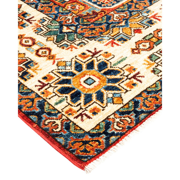 An ornate hand-woven rug showcasing a vibrant Persian-inspired design.