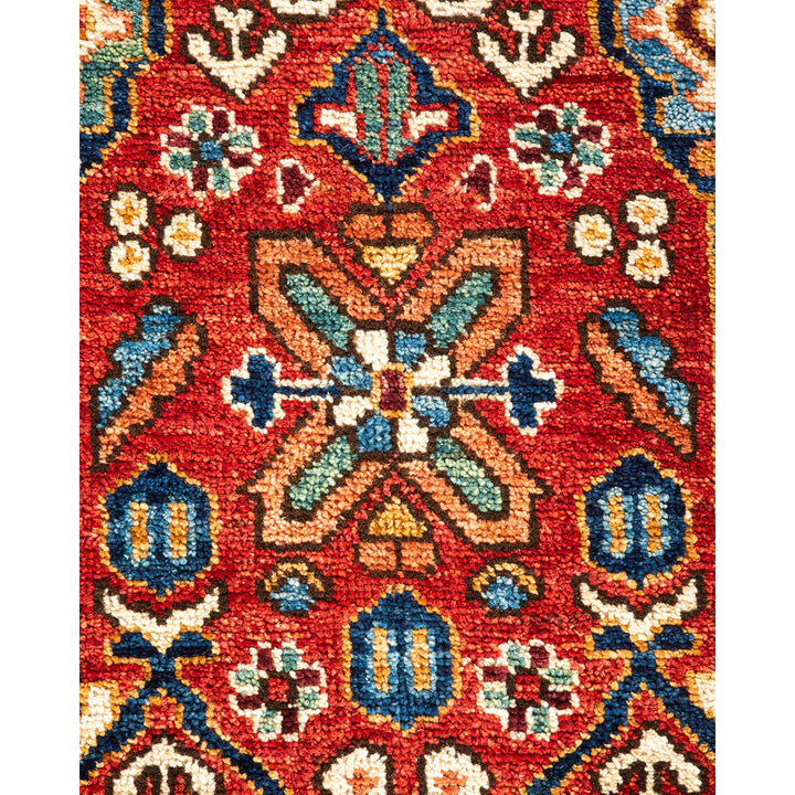 Vibrant and intricate traditional woven rug with floral motifs.