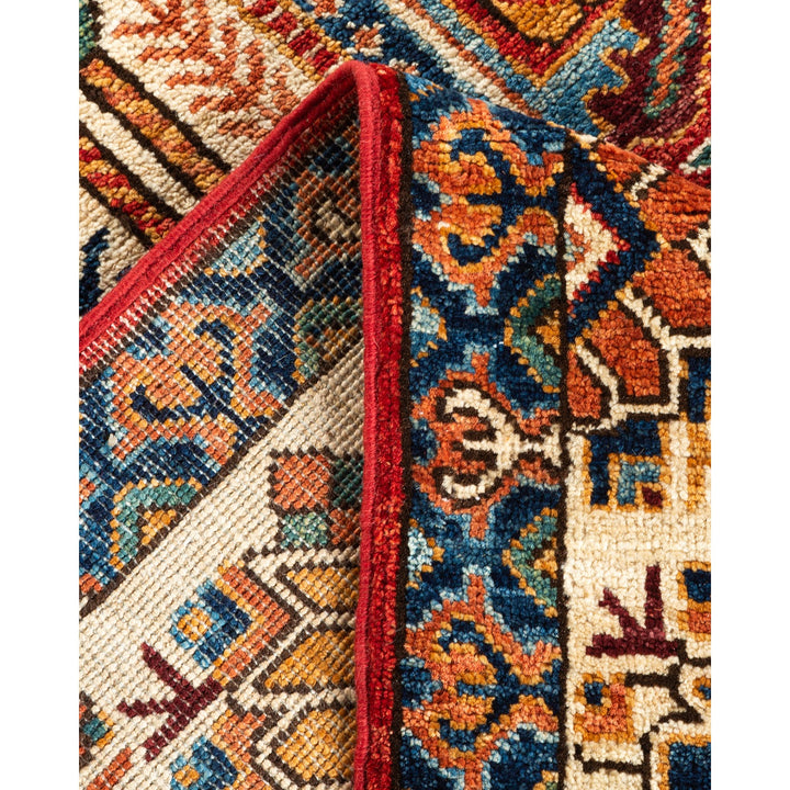 Close-up of a handwoven Oriental rug with intricate geometric patterns.