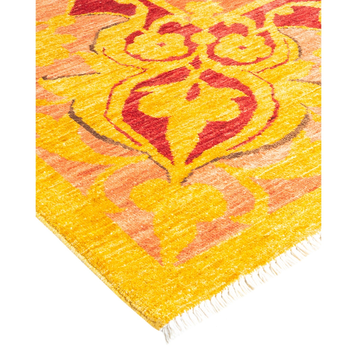 Vibrant, ornate rug with floral-like pattern in warm hues.