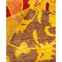 Vibrant floral patterned rug with warm colors and plush texture.