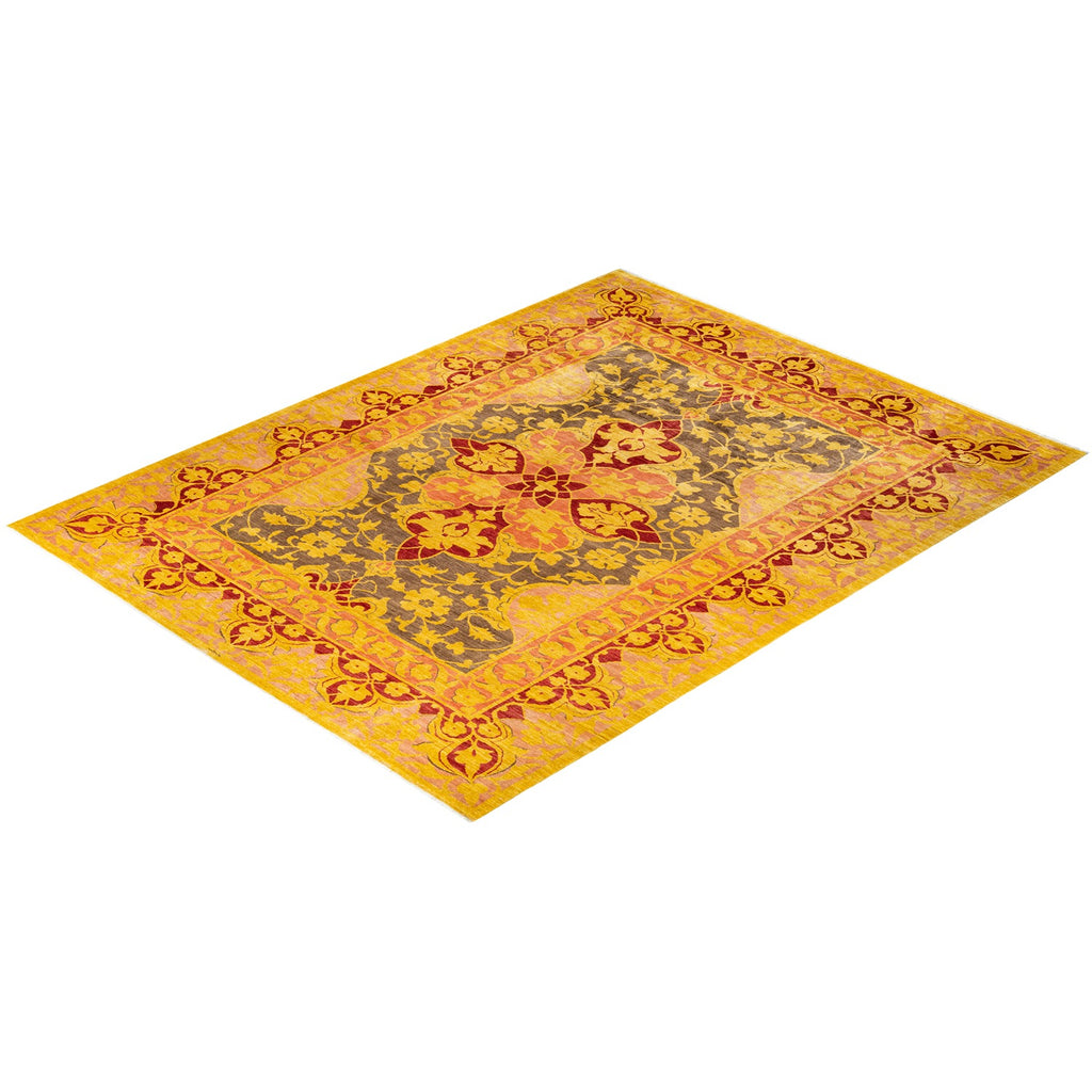 An ornate yellow and orange rug with intricate floral patterns.