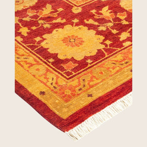 Exquisite hand-knotted oriental rug with intricate design in red and gold. - hover