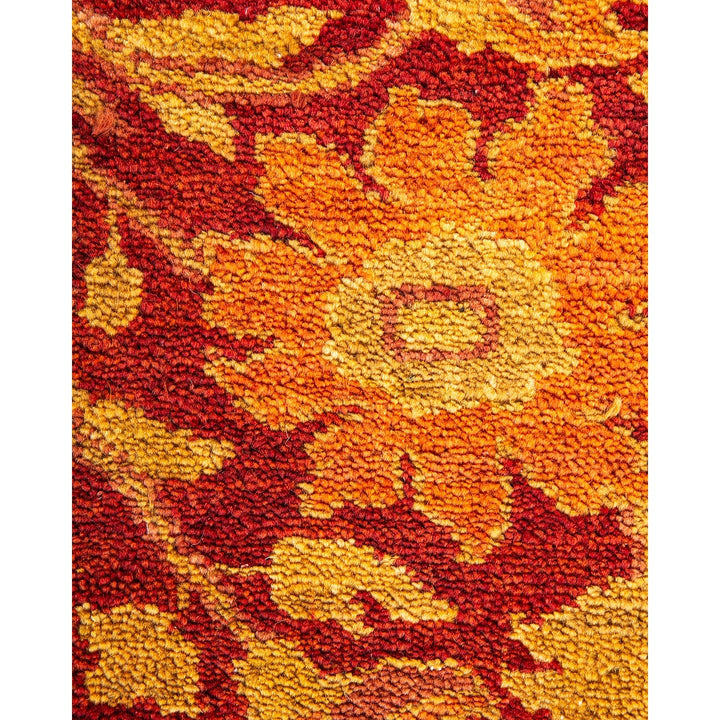 Close-up of a vibrant, ornamental fabric with floral motifs.