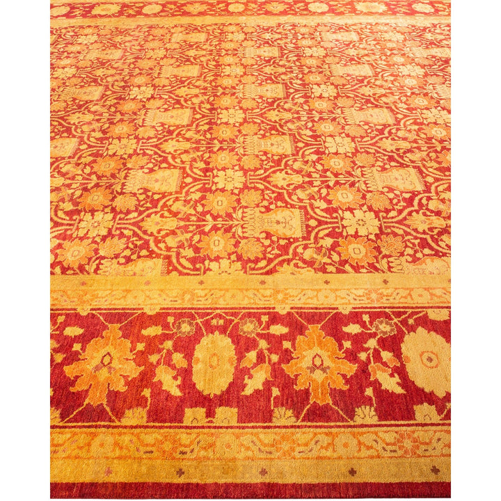 Exquisite, symmetrical rug with rich red and gold motifs.