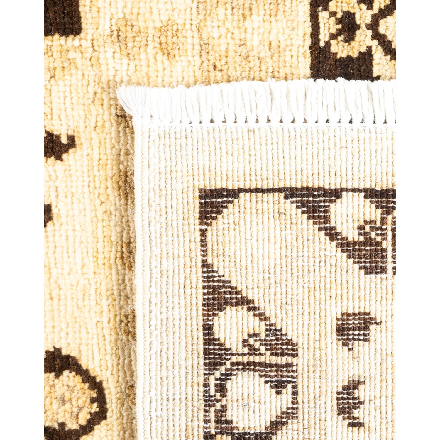 Close-up view of a textile rug with two distinct patterns.