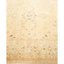 Intricate Oriental carpet with symmetrical patterns in neutral tones.