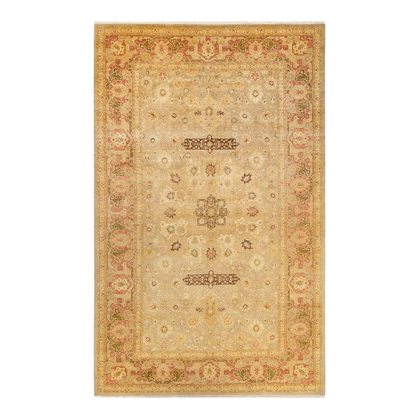 Traditional-style rug featuring intricate symmetrical pattern in subdued colors.