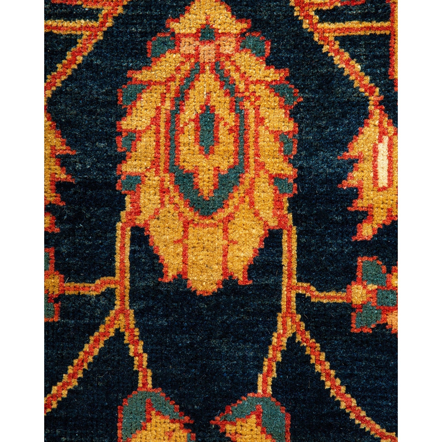 Close-up of a symmetrical, detailed oriental rug with rich colors