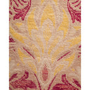 Intricate floral pattern in burgundy and yellow on beige fabric.
