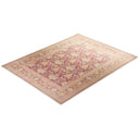 Traditional rectangular rug with pink floral motif and intricate border.