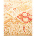 Intricate Oriental-inspired rug with symmetrical patterns and warm tones.