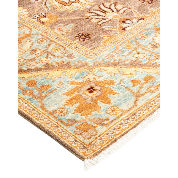 Ornate rug with floral and geometric designs in beige and blue.