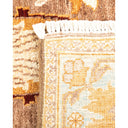 Intricately woven rug showcases contrasting textures and detailed craftsmanship.