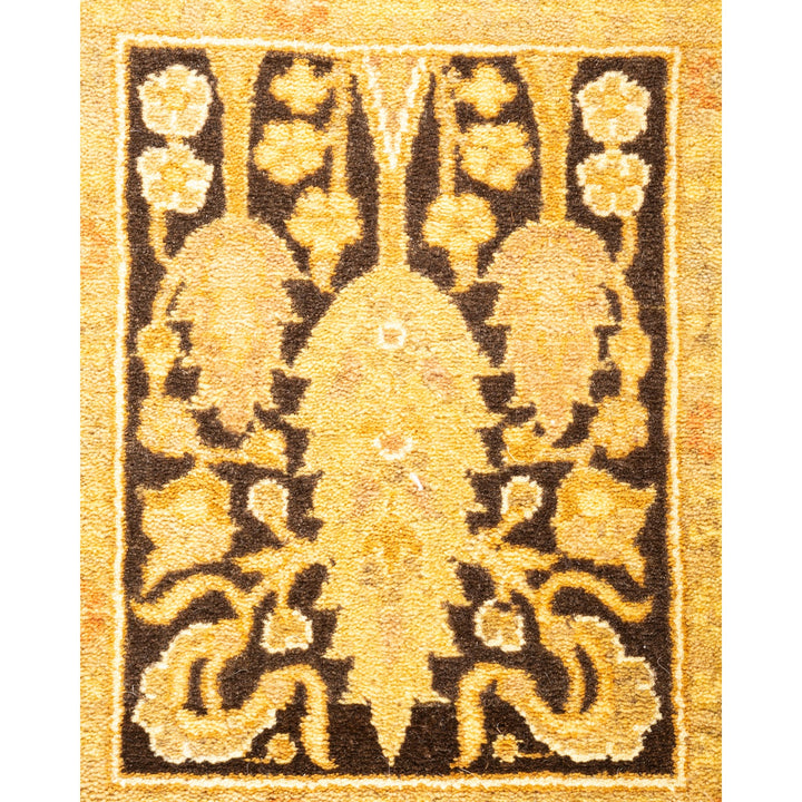 Close-up photograph of a traditional, ornamental rug with wear signs.